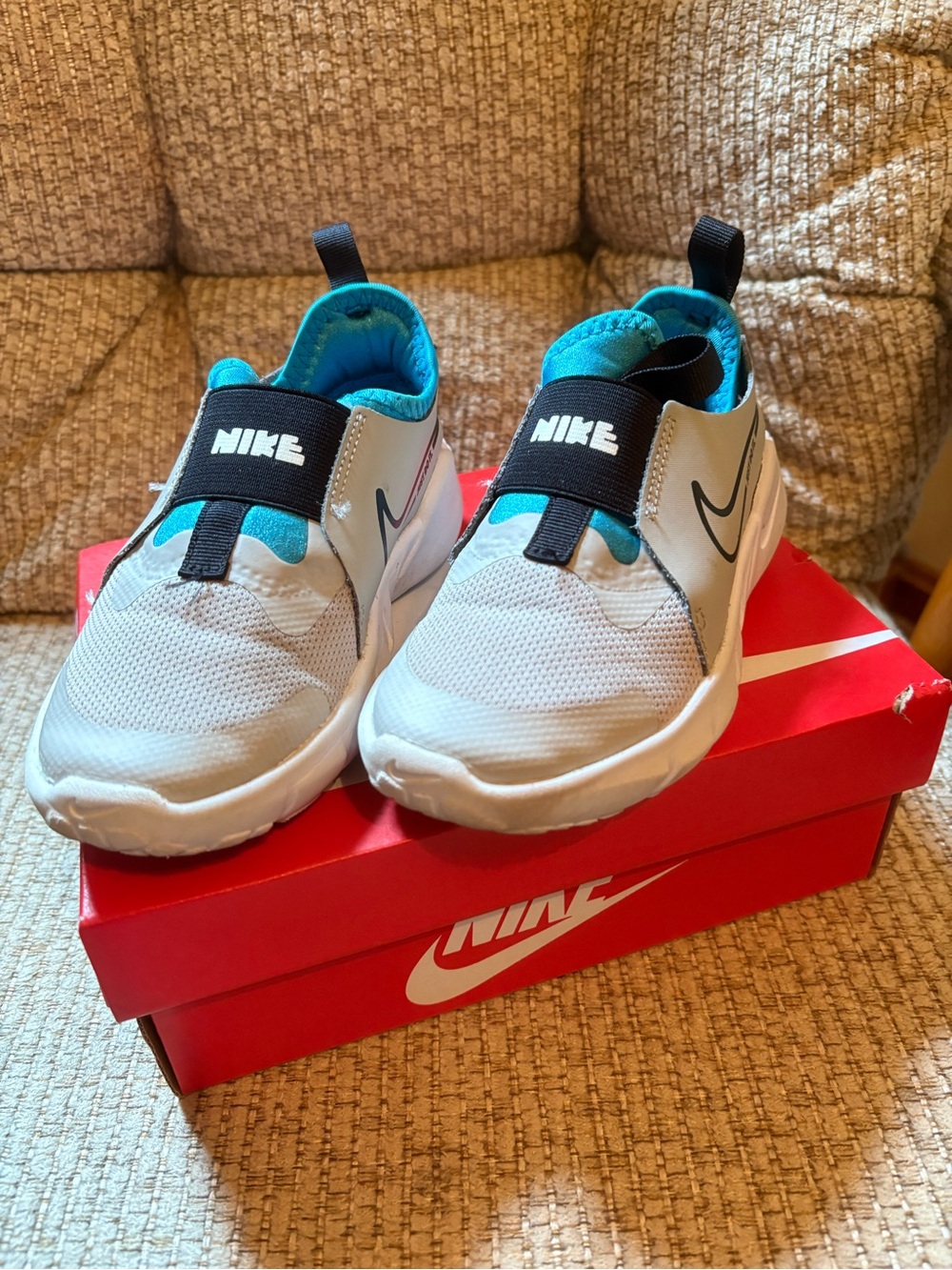 Nike Kids Slip-On Sneakers in White with Teal and Black Accents